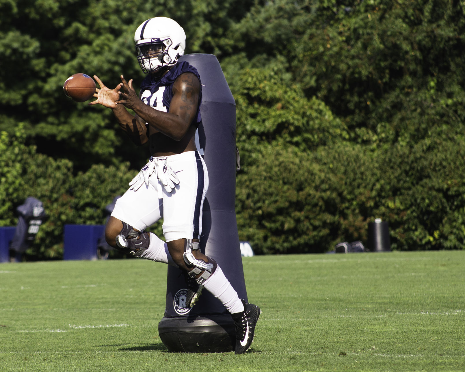 Football Media Day, Simmons (34) catching a ball